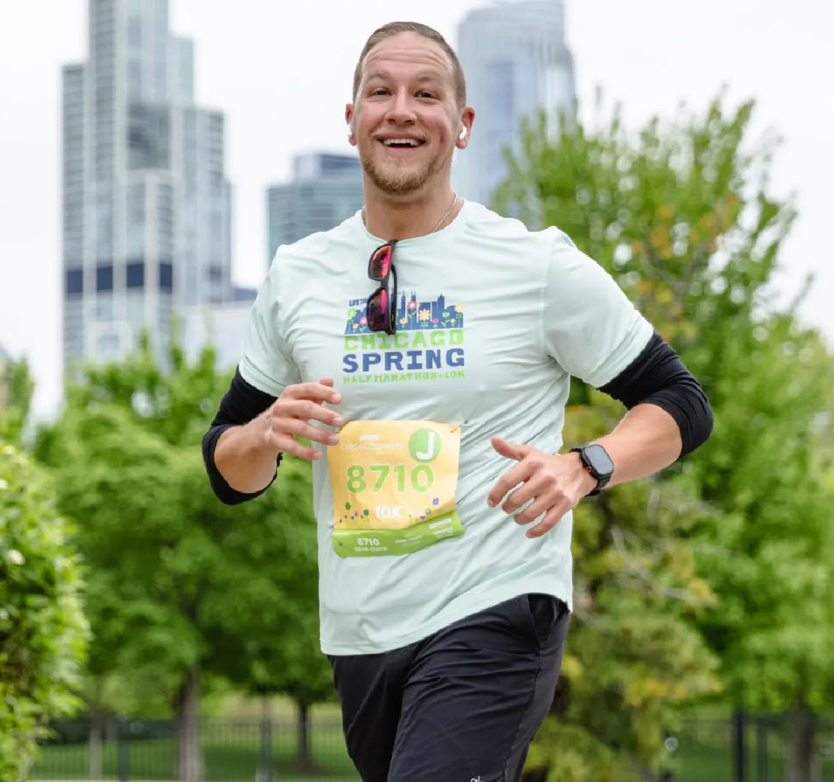 smiling man running in Chicago half marathon