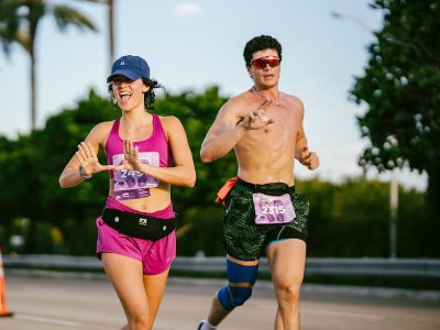 male and female runners at miami marathon